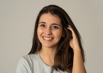 Portrait of young attractive brunette woman with happy face and gorgeous hair. Human expressions