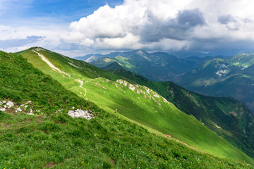 Obraz premium Whirling clouds over the peaks of the Tatra Mountains in June.