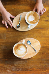 Two cups coffee latte decorated image heart