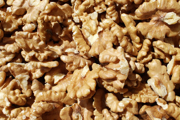 Walnuts. Peeled walnuts background texture. Walnut wallpaper. Kernel