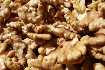 Walnuts. Peeled walnuts background texture. Walnut wallpaper. Kernel