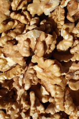 Walnuts. Peeled walnuts background texture. Walnut wallpaper. Kernel