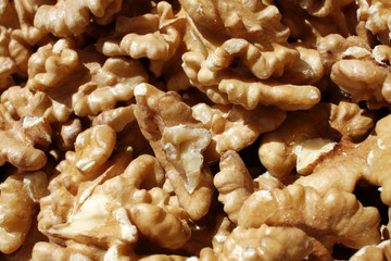 Walnuts. Peeled walnuts background texture. Walnut wallpaper. Kernel