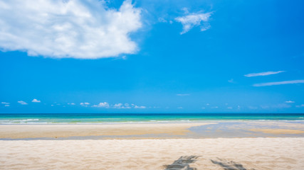 Fototapeta na wymiar Sand beach and blue sky background
