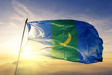 Bayan-Olgii province of Mongolia flag waving on the top sunrise mist fog