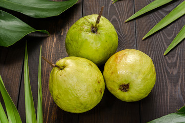 Guava on a green background.