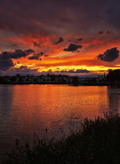 Orange sunset with dramatic clouds over the Schwerin old town. Mecklenburg-Vorpommern, Pomerania, Germany