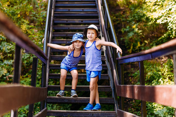 two boy standing on the stairs