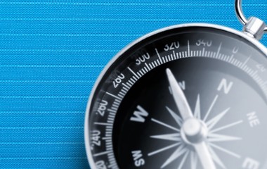 Brass antique compass  on background