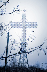 Cross raises from the fog