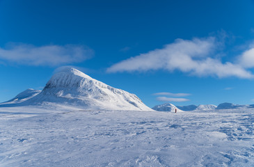 Fototapeta na wymiar Silhouette of a lone cross country skier in national park Sarek. Lapland, Sweden.