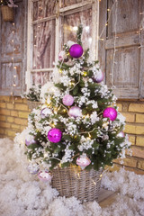 Fototapeta na wymiar decorated Christmas tree artificial snow