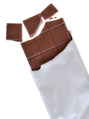 Chocolate with broken cubes in silver foil packaging isolated