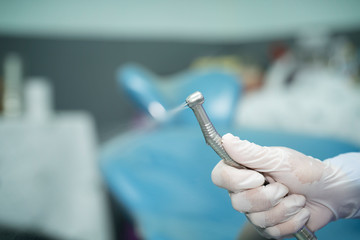 dentist hand holding dental tool to clean oral cavity,tartar drill