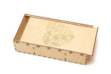wooden box with an engraving in the form of a heart on white background