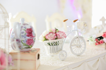 Flower and bicycle table decoration at a wedding reception