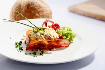 Scrambled eggs with chives and fried bacon.