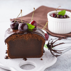 Chocolate loaf cake with fresh berries. Sweet pastry.