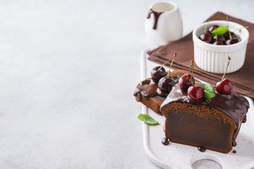 Chocolate pound cake for breakfast with glaze and fresh berries.