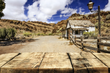 Fototapeta premium Wooden old table of free space for your decoration and Wild West background. 