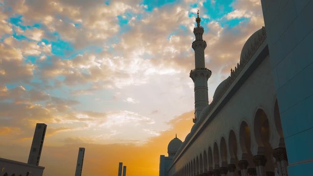 A Young Girl Walks Into a Mosque at Sunset. Travel to the East