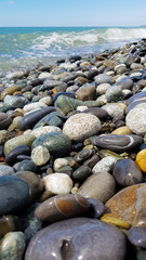 pebbles on the beach, rubble on the seashore, top view