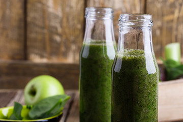 Healthy green fruits and vegetables smoothie, spinach, avocado, apple, celery and lime juice drink