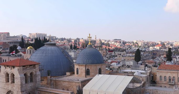 Slow zooming on two domes and belfry of the Church of the Holy Sepulchre in Jerusalem, Israel