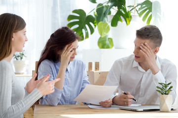 Employers and candidate sitting in office during interview