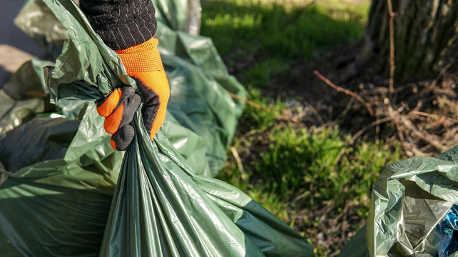 Hand Man Picking Up Trash Cleaning In The Street , Volunteer Concept