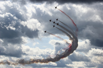 silhouettes of aircraft in the sky
