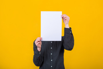 woman cover face using  blank sheet