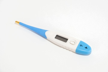 Digital thermometer blue sky& white on a white background