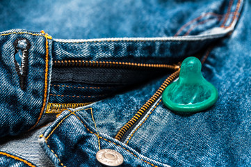 green condom in jeans 