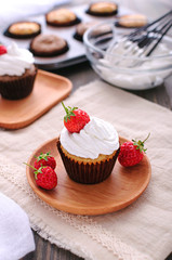 Cupcake with protein cream and strawberries.