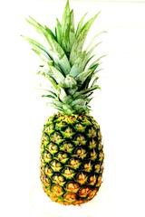 ripe pineapple on a light white background