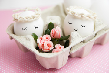 Easters eggs with cute face and flowers. Cute romantic idea.