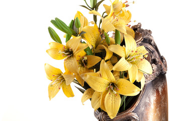  A bouquet of flowers on a white background. Beautiful fresh yellow lilies.