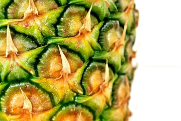 ripe pineapple on a light white background