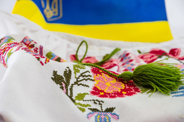 blue-yellow flag of Ukraine and part of an embroidered shirt