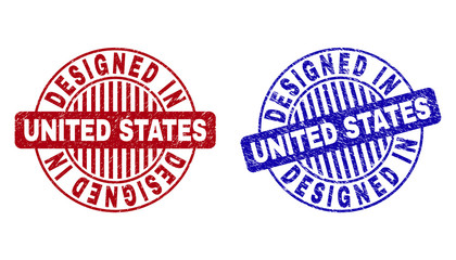 Grunge DESIGNED IN UNITED STATES round stamp seals isolated on a white background. Round seals with grunge texture in red and blue colors.