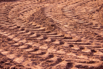 Tractor tire tracks on dry soil in Europe