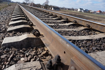 High speed passenger train on tracks with motion blur effect at sunset. Railway