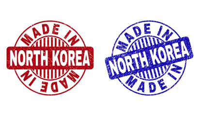 Grunge MADE IN NORTH KOREA round stamp seals isolated on a white background. Round seals with grunge texture in red and blue colors.