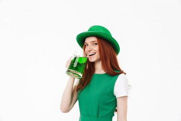 Happy young redheaded girl wearing green hat