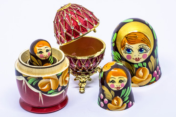 Matryoshka family. Matrioska art Russian doll and Russian souvenir, egg casket copy of Faberge on a White background