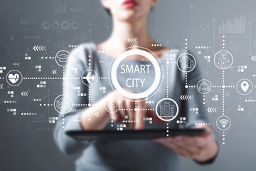 Smart city concept with woman using a tablet