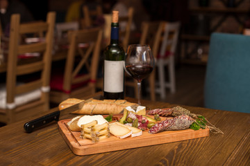 Cheese, sausages and red wine as an appetizer