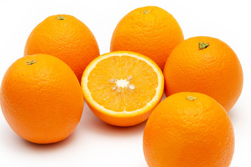 oranges and sliced orange on white background