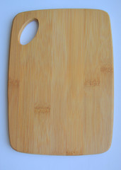 wooden cutting board on blue background